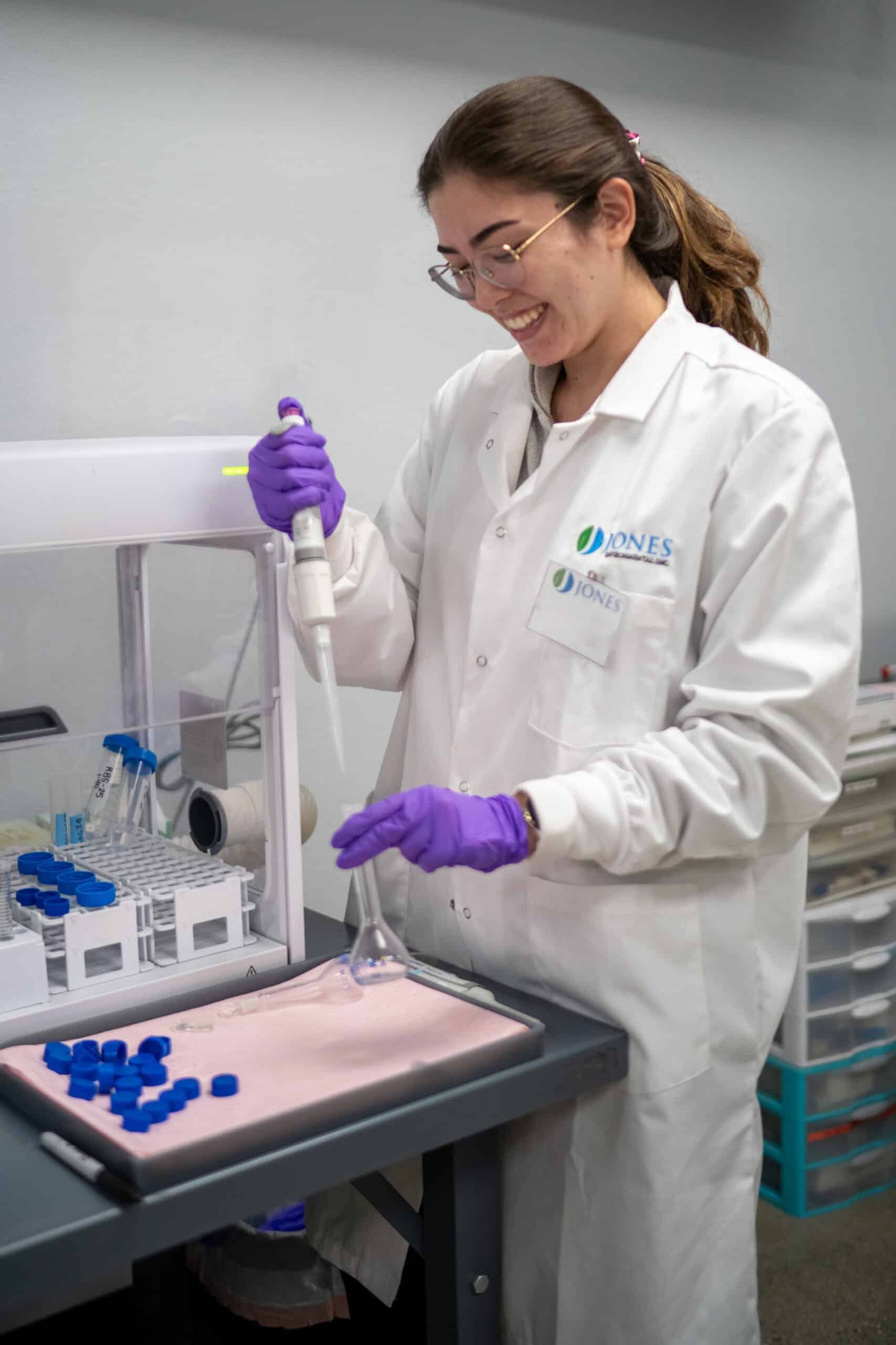 Jones Environmental chemist pipetting samples in the lab